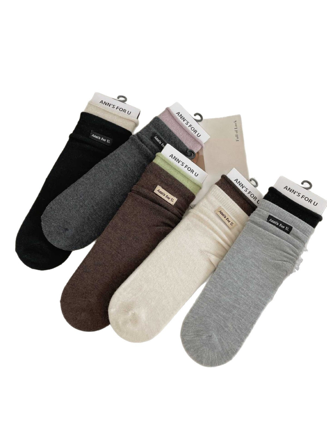 Ivory, Brown, Light Gray, Dark Gray and Black socks with contrasting cuffs arranged on a white background.