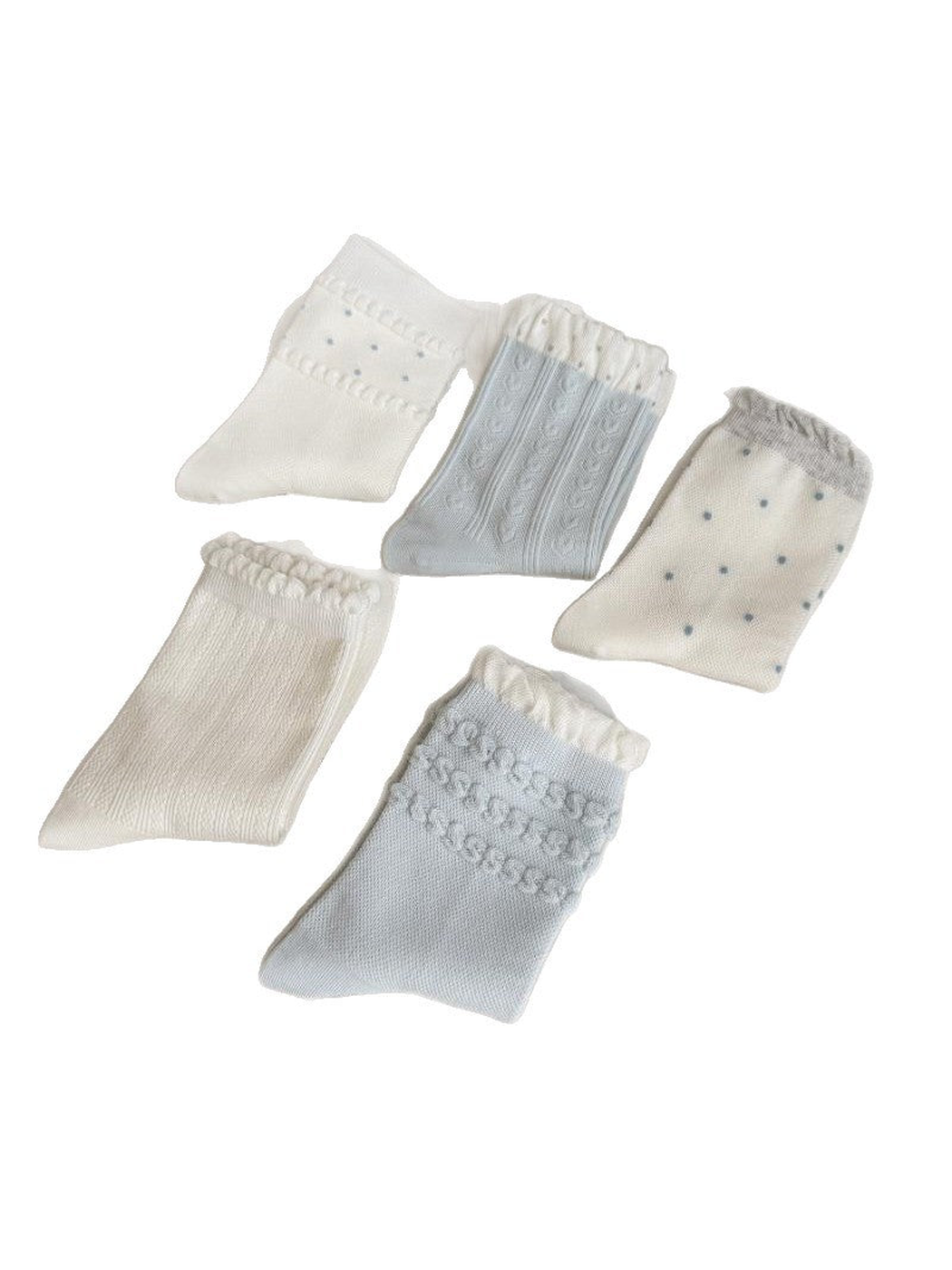 Five sock styles with hearts, ribbing, dot bands, scattered dots and raised loops on a white background.