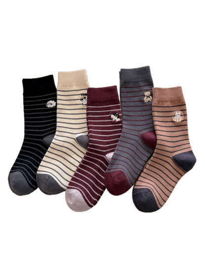 Black, Ivory, Burgundy, Gray, and Camel striped socks with animal motifs displayed on a white background.