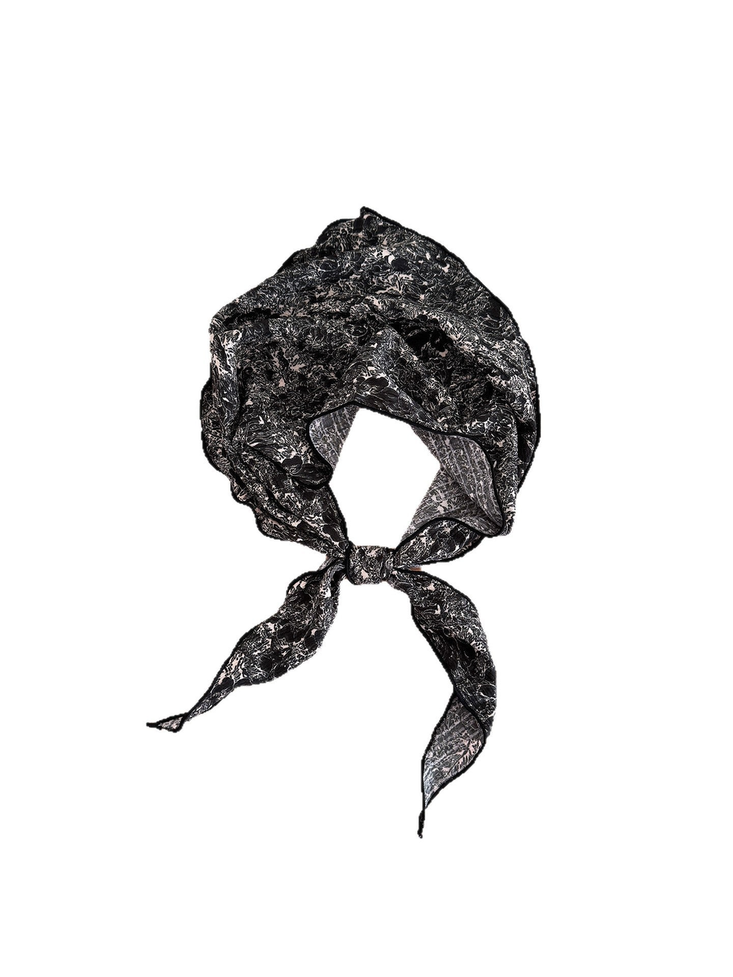 Black scarf with pale floral linework tied in a loop with pointed ends against a white background.