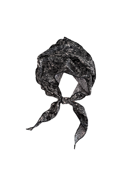 Black scarf with pale floral linework tied in a loop with pointed ends against a white background.