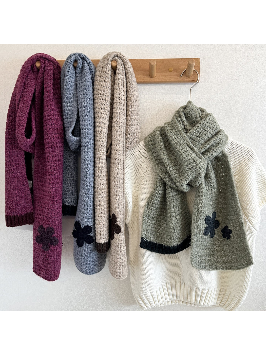 Purple, Blue, Beige and Green flower appliqué scarves displayed with hanging and wrapped drapes