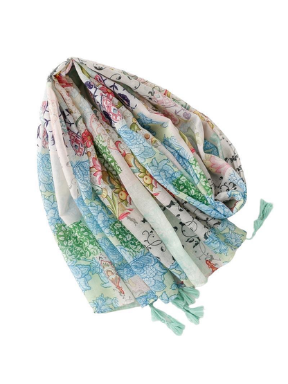 Full view of the mint green rectangular scarf with floral patchwork print and tassels