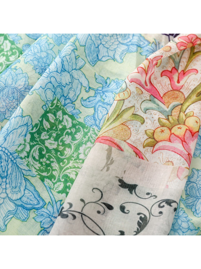 Close-up of blue and pink floral panels beside a green ornamental panel