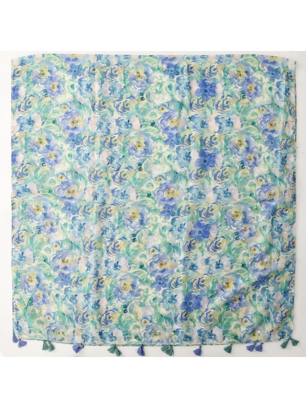 Blue, mint green and white watercolor floral scarf laid flat with tassels along one edge
