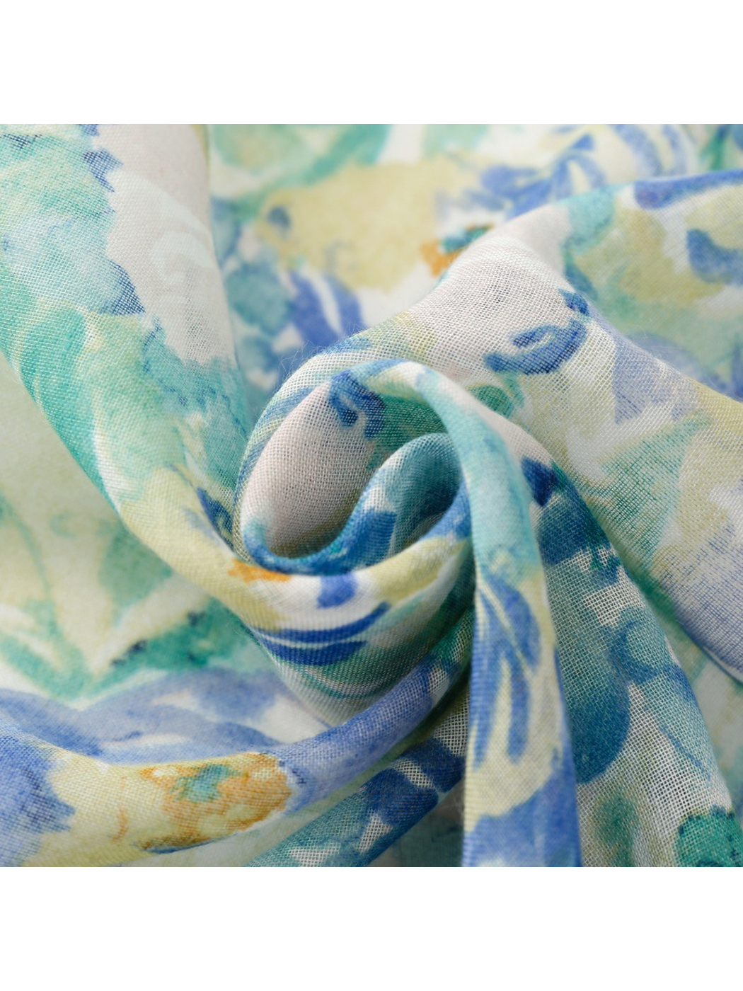 Close-up of the blue and mint watercolor floral scarf's fine semi-sheer weave
