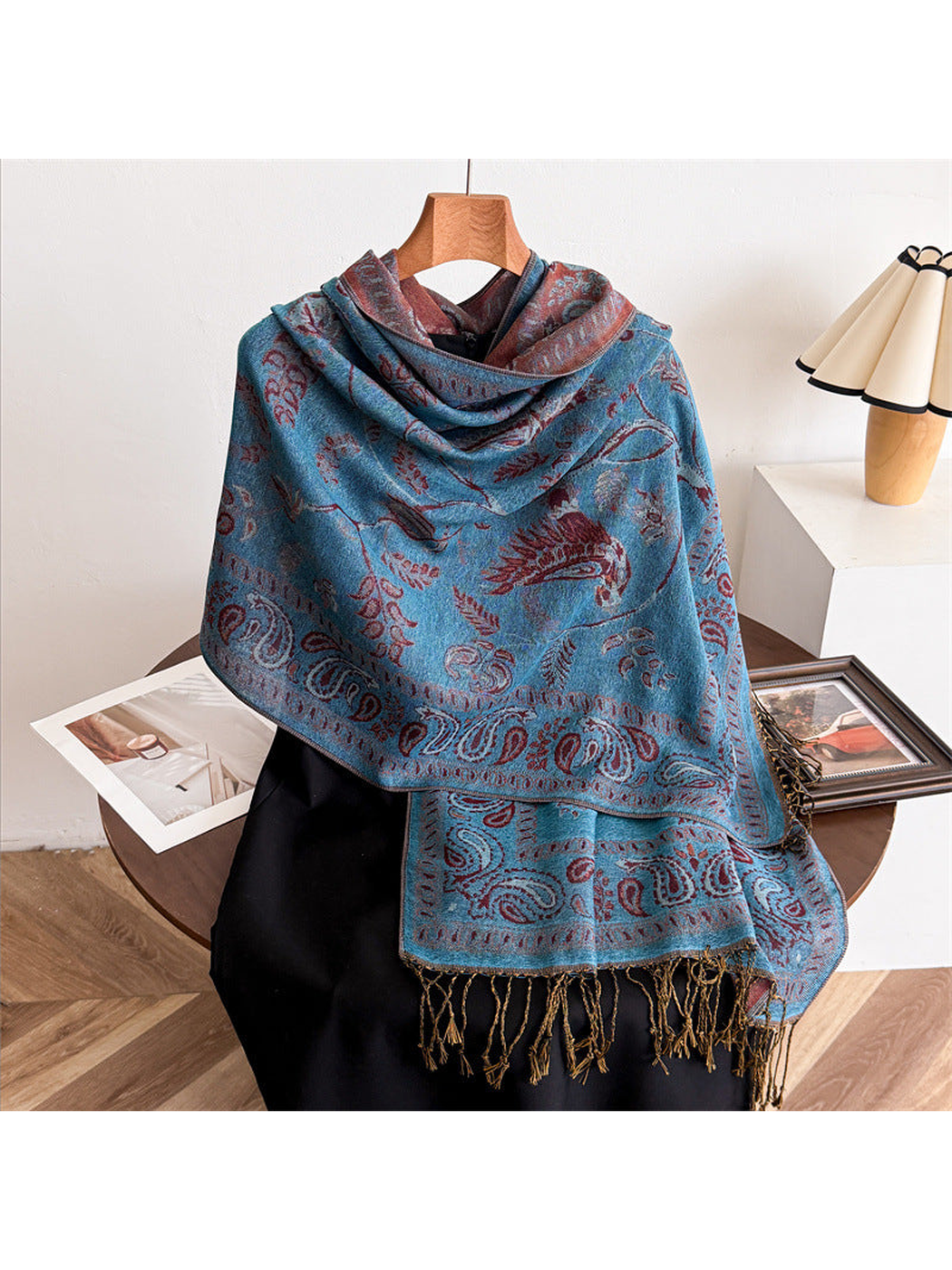 Gray Blue bird and paisley scarf draped over a black mannequin