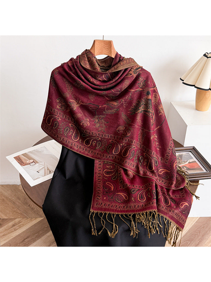 Burgundy bird and paisley scarf draped over a black mannequin