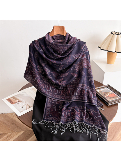 Purple bird and paisley scarf draped over a black mannequin