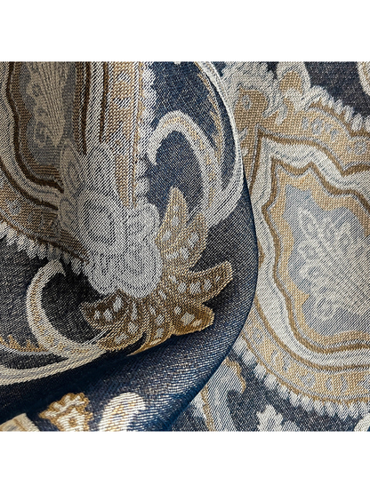 Close-up of the paisley weave in navy, cream, and tan tones
