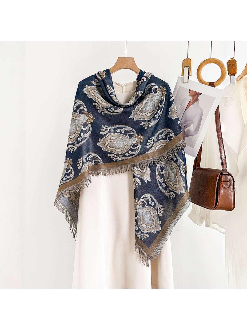 Navy paisley scarf draped asymmetrically over a white dress