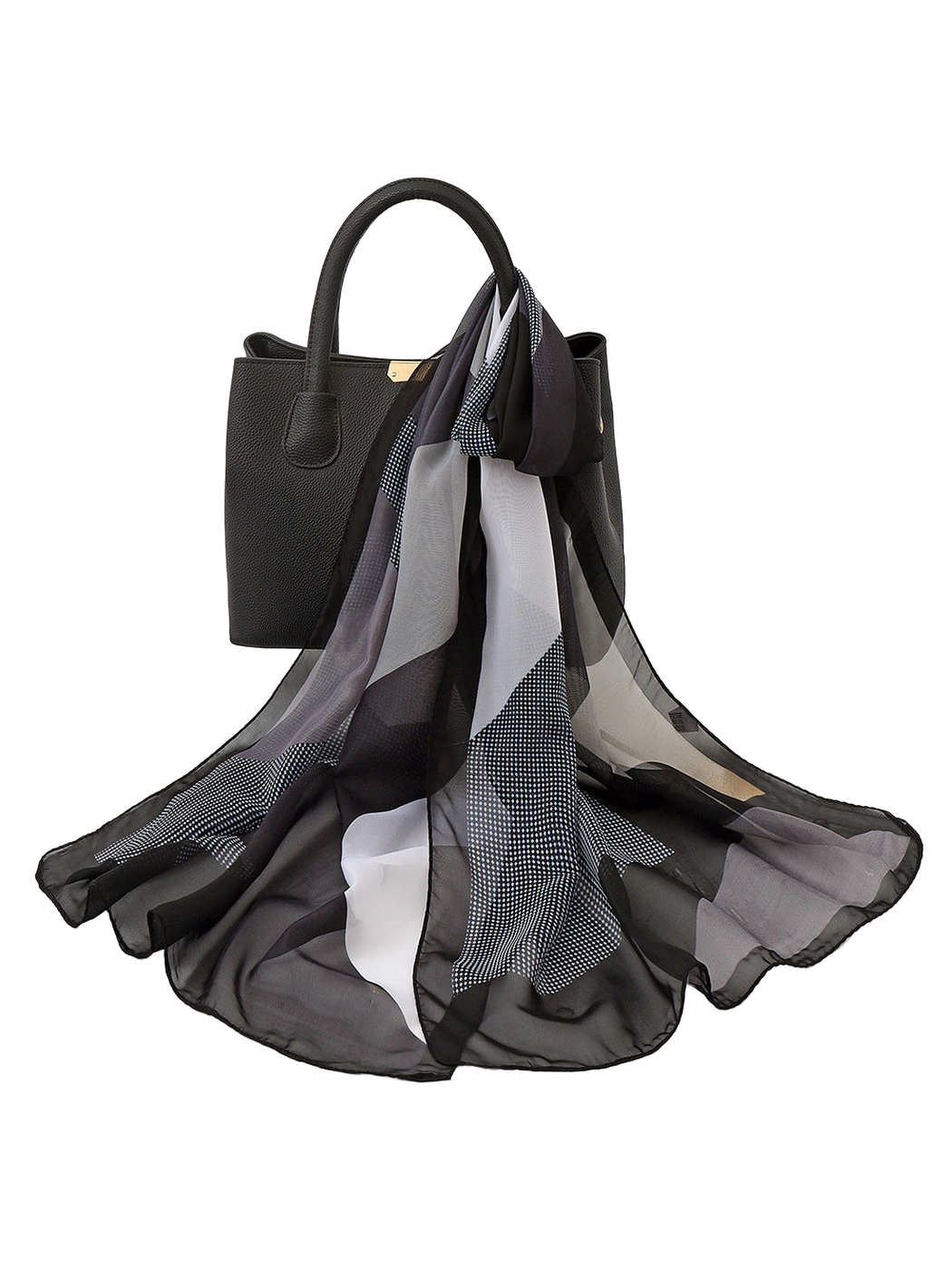 Black and white sheer geometric scarf draped over a black handbag