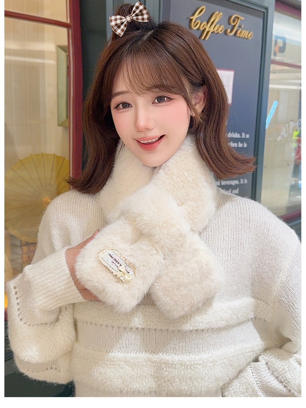 Off-white fuzzy pull-through scarf worn in a front-facing café setting