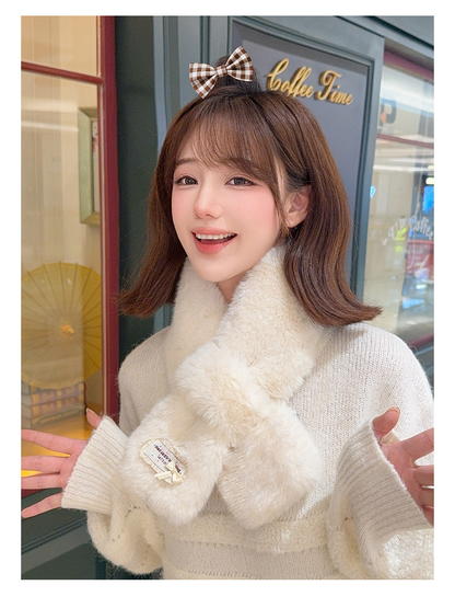 Off-white fuzzy pull-through scarf worn with the crossed front fully visible
