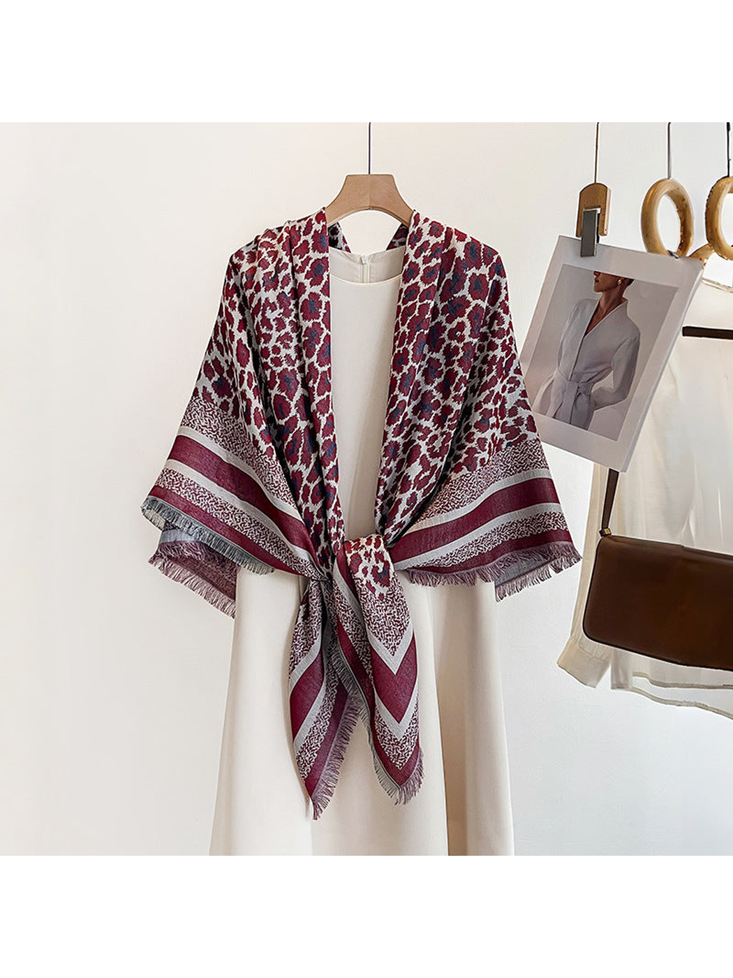 Burgundy animal-print square scarf styled in a tied front drape