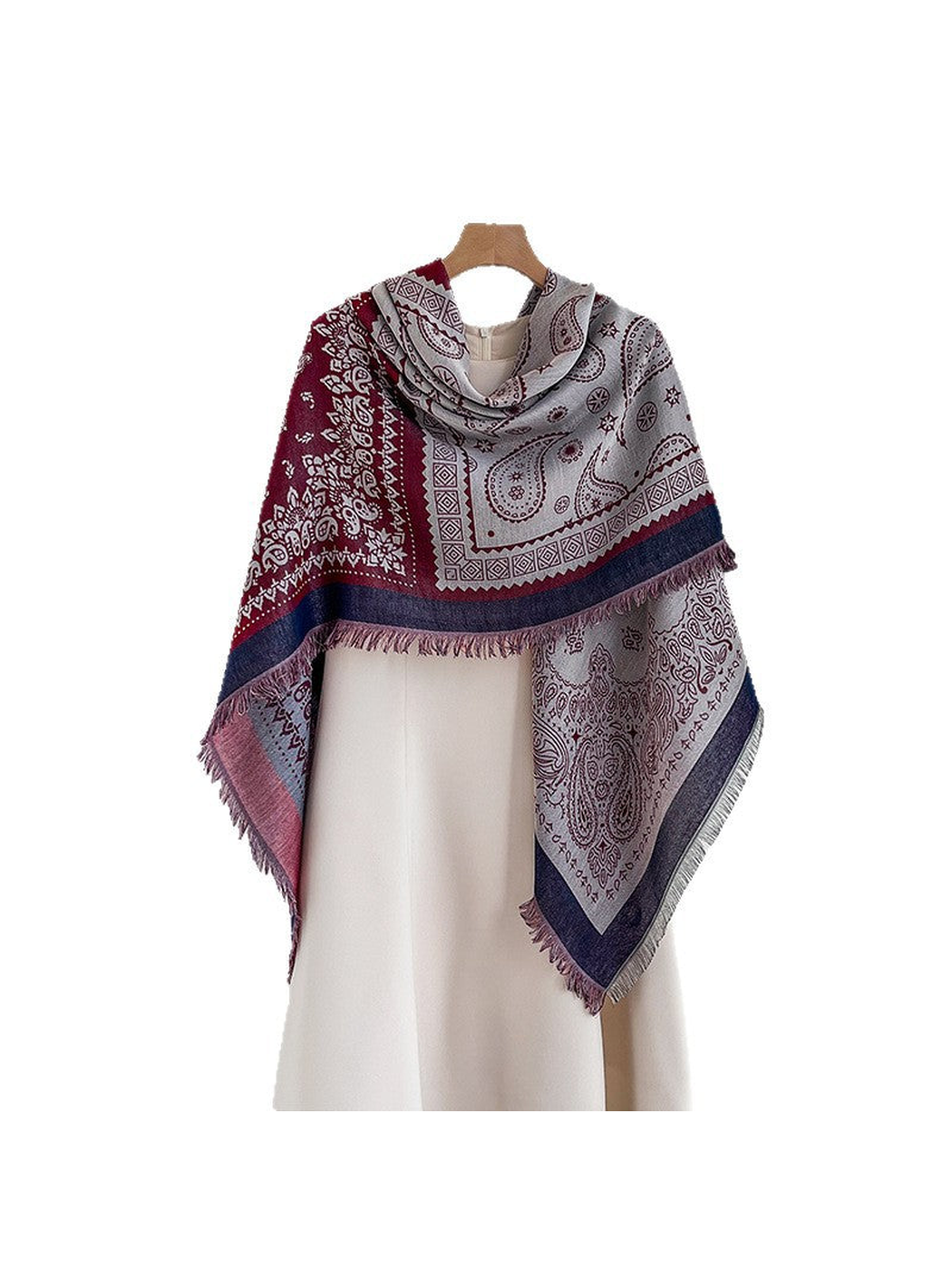 Paisley square scarf draped asymmetrically over a light dress