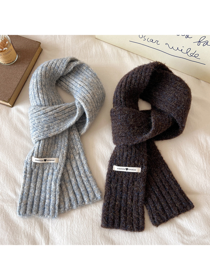 Gray-blue and dark brown ribbed scarves arranged side by side