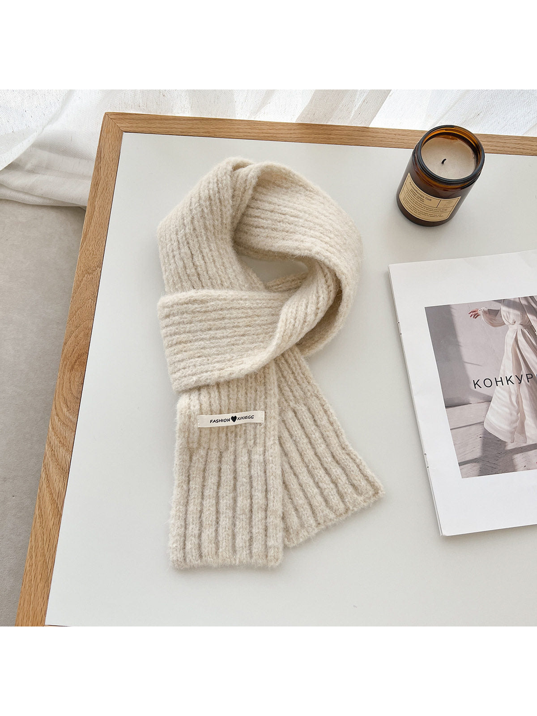 Ivory fuzzy ribbed scarf arranged in a loop