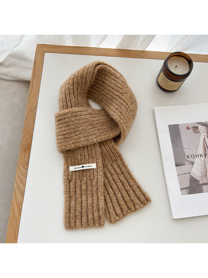 Camel fuzzy ribbed scarf arranged in a loop