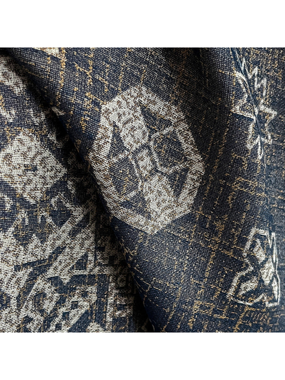 Close-up of the dark geometric pattern and woven-look surface