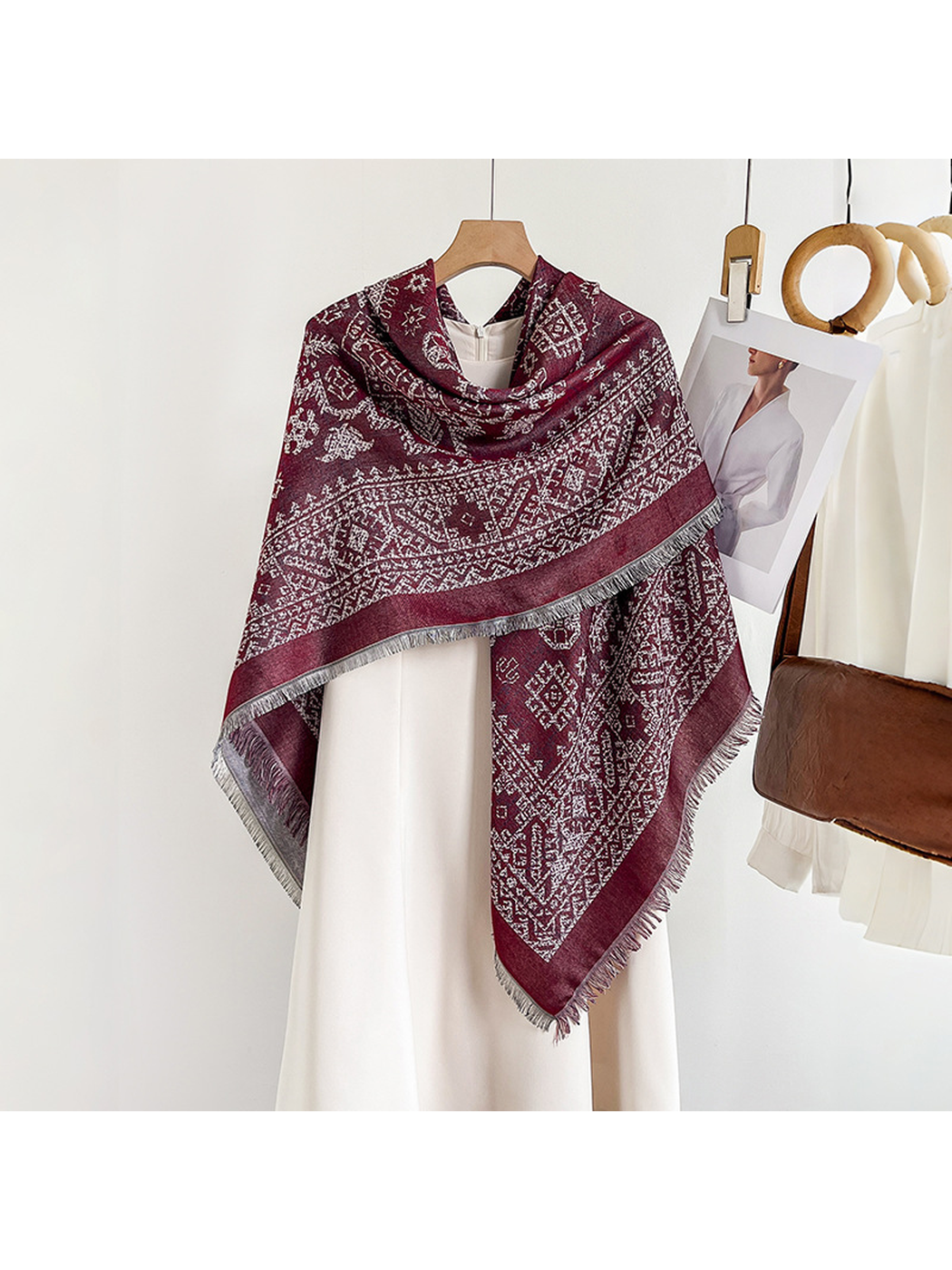 Burgundy geometric square scarf wrapped across the shoulders