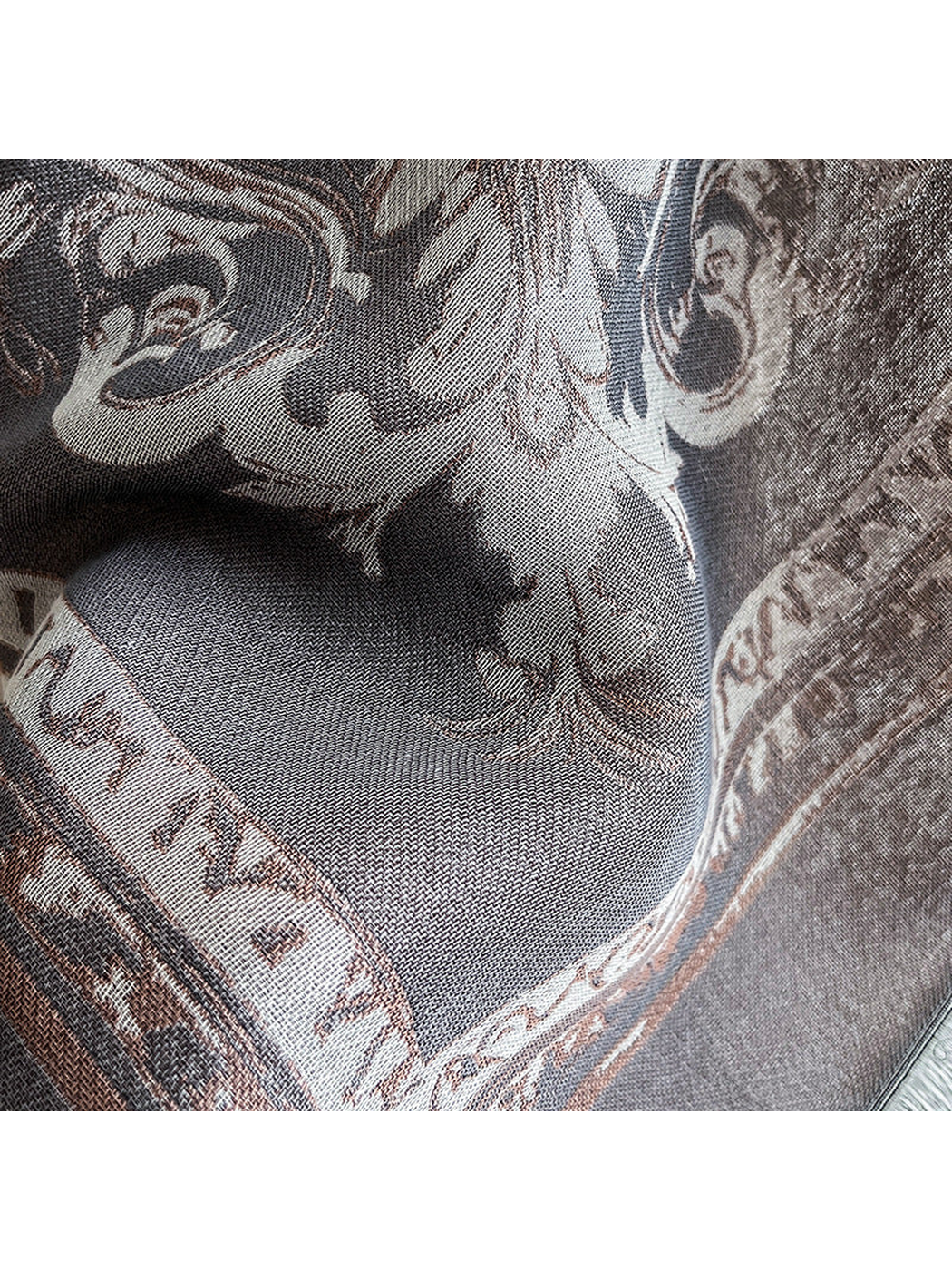 Close-up of the fine woven texture and ornamental border