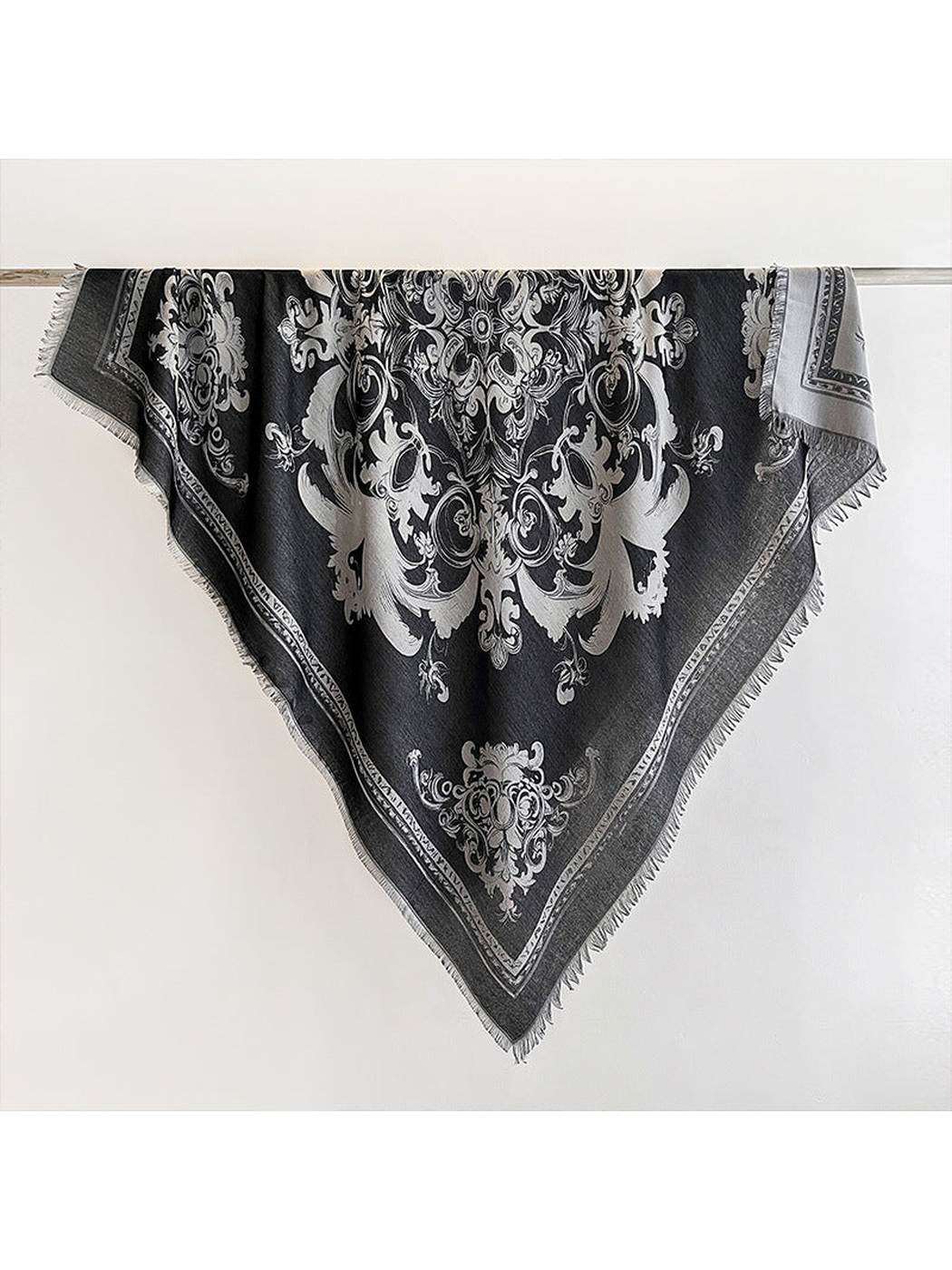 Black square scarf with ornamental motif and fringed edges