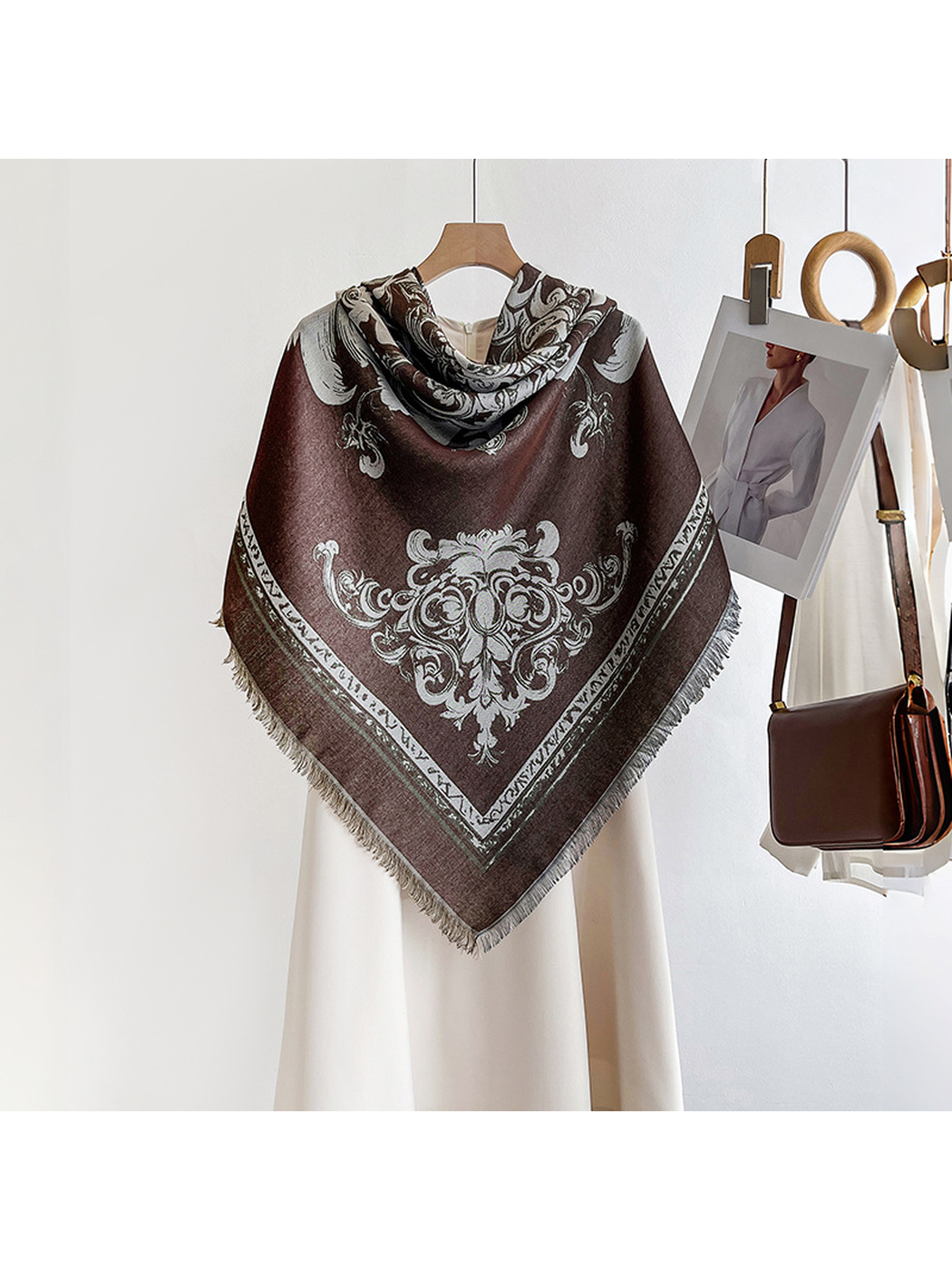 Dark brown ornamental scarf arranged in a centered triangular drape