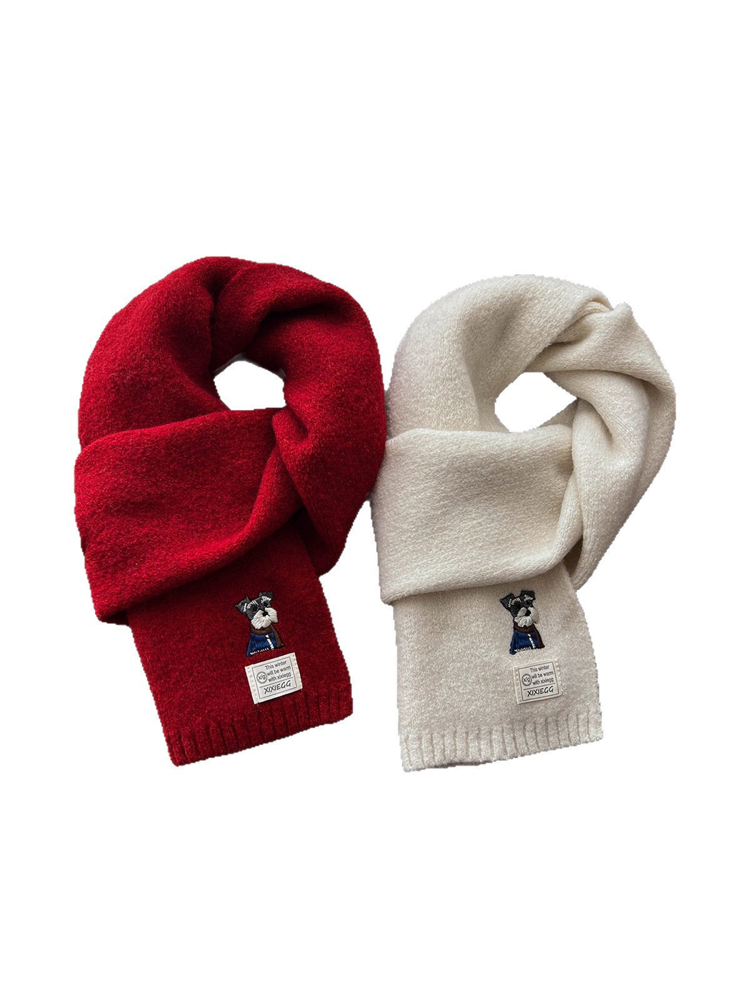 Red and ivory fuzzy scarves with embroidered dog motifs on a white background