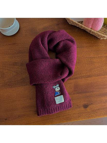 Deep purple fuzzy scarf with embroidered dog motif and ribbed end