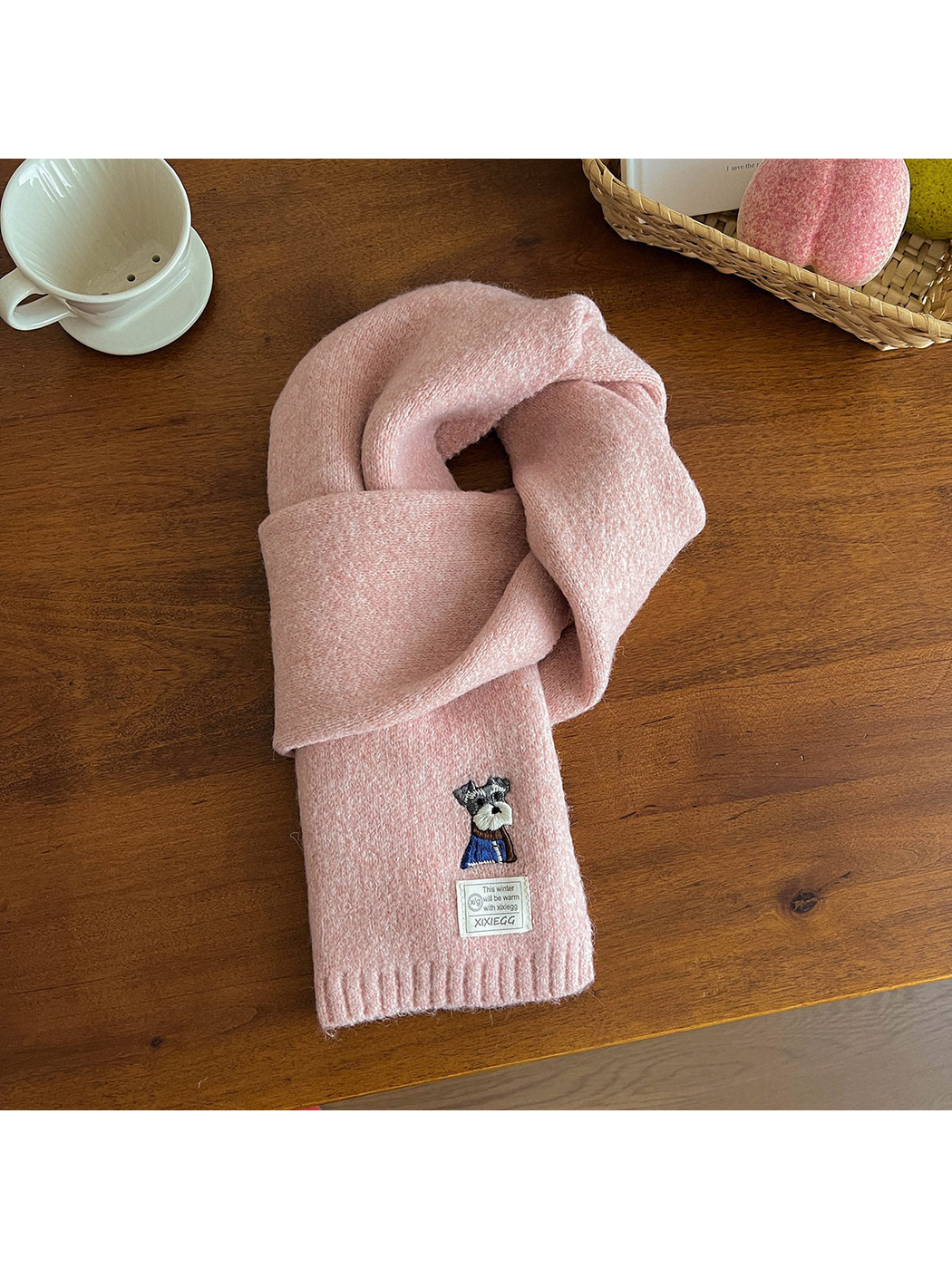 Light pink fuzzy scarf with embroidered dog motif and ribbed end
