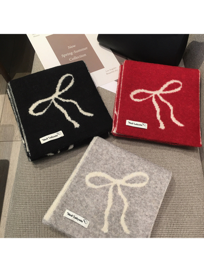 Black, red and gray bow-pattern scarves displayed together