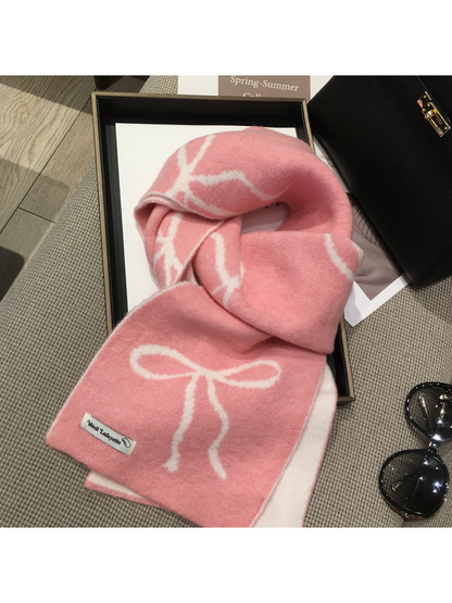Pink scarf with cream bow motifs, draped view