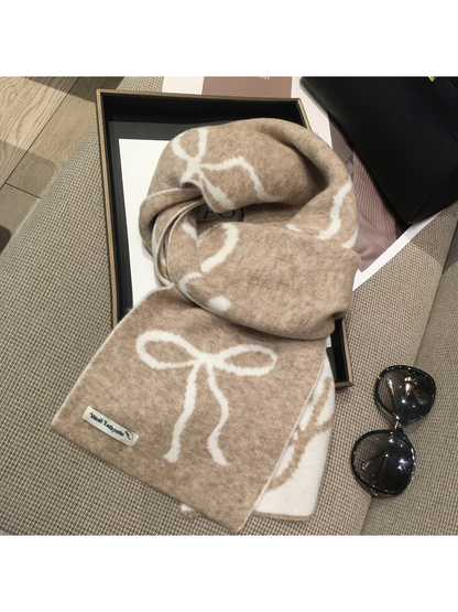 Beige scarf with cream bow motifs, draped view