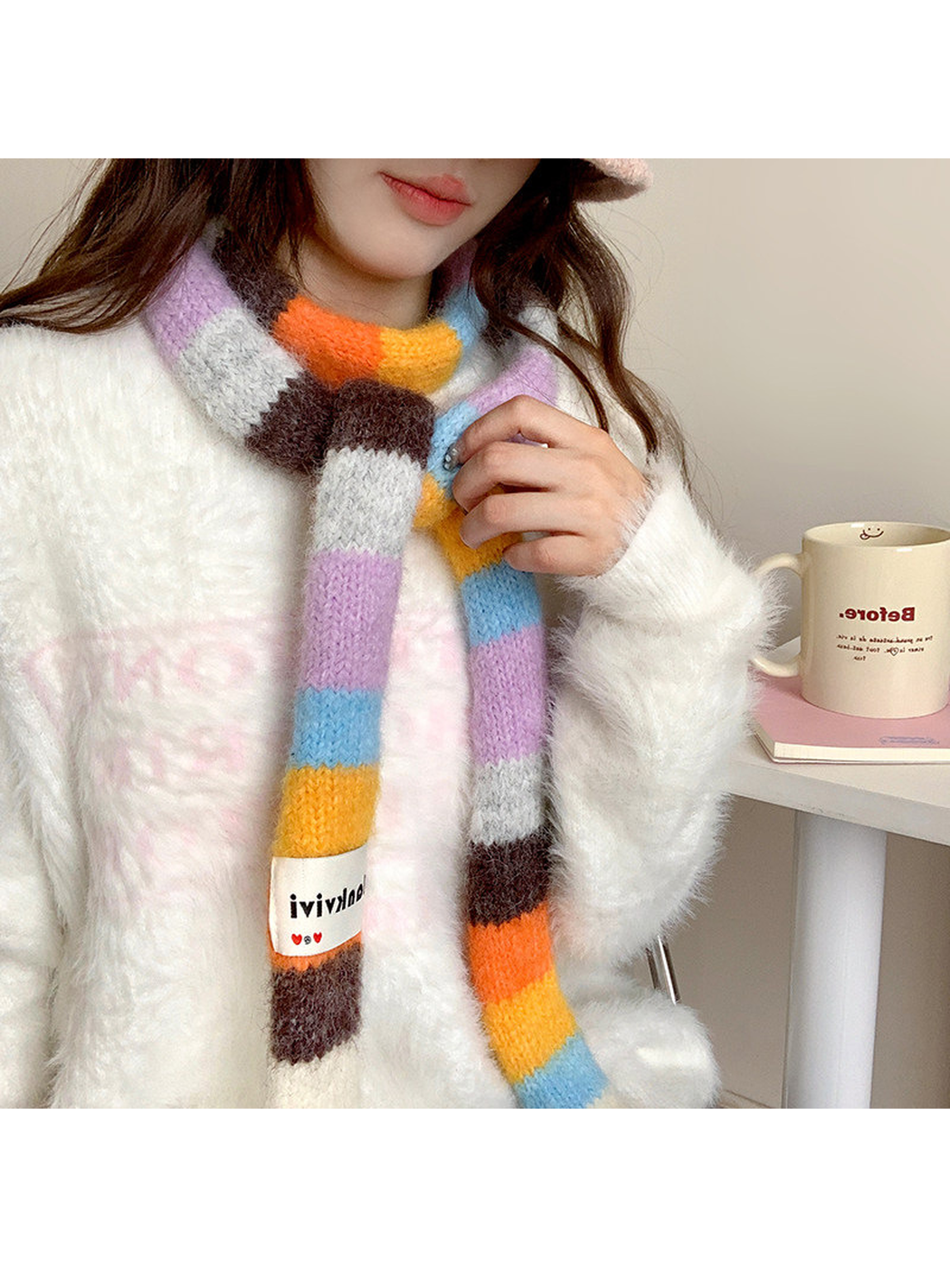 Orange, brown, lavender and blue fuzzy color-block scarf worn with two ends hanging forward