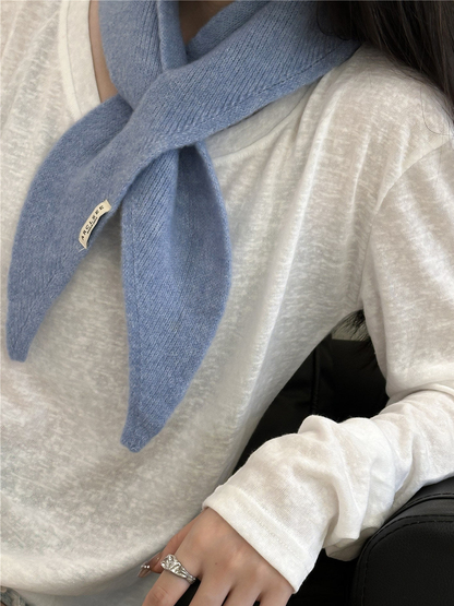 Light blue pull-through scarf with tapered ends, worn view