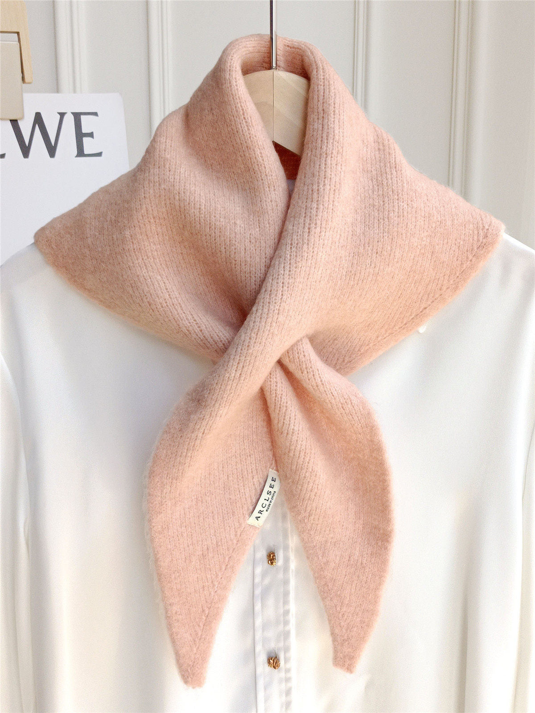 Blush pink pull-through scarf displayed on a white shirt