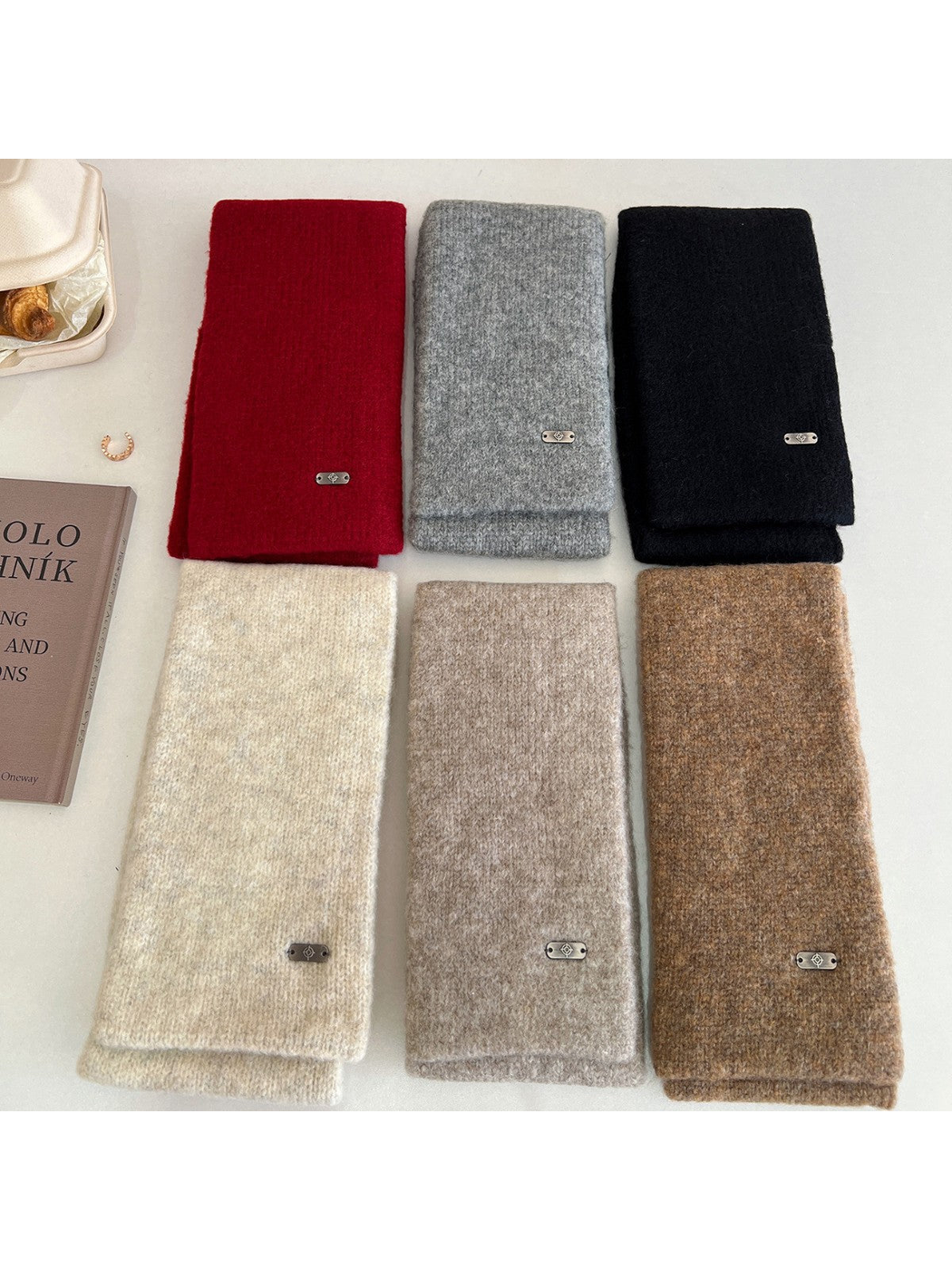 Six solid-color narrow scarves displayed together in red, gray, black, ivory, greige and brown