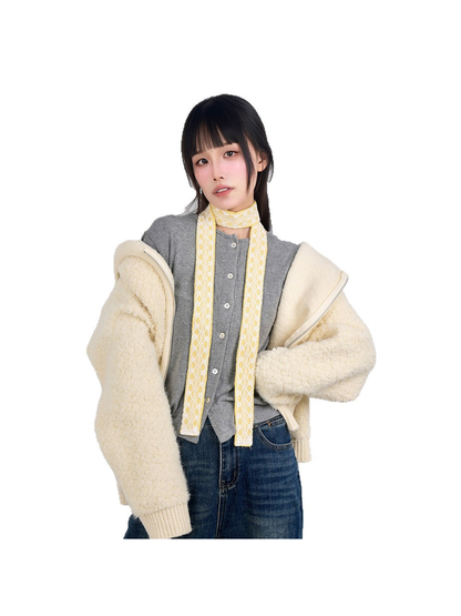 Yellow lace-trim skinny scarf styled with a cream jacket and jeans