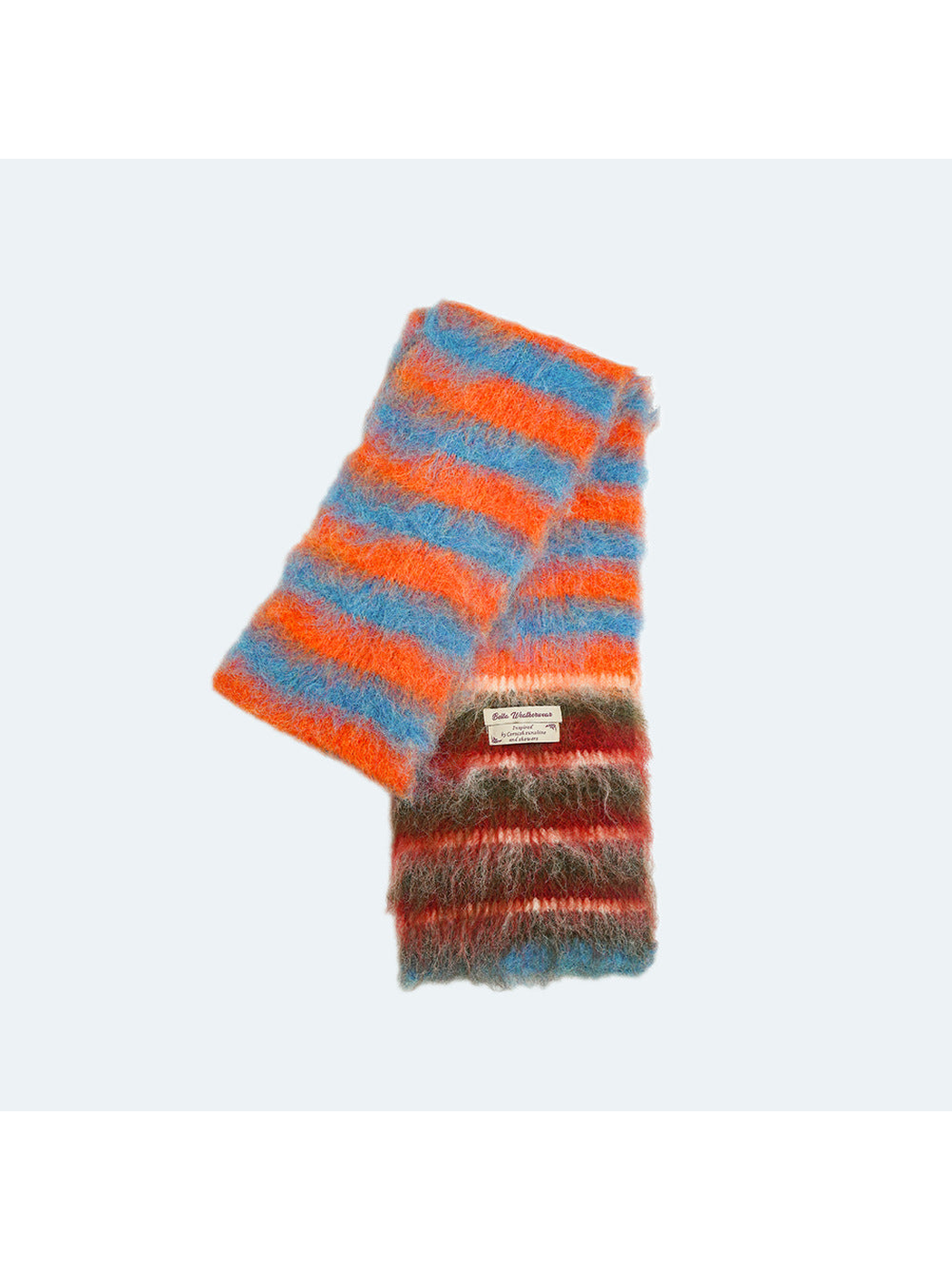Orange, blue and red striped fuzzy scarf displayed folded