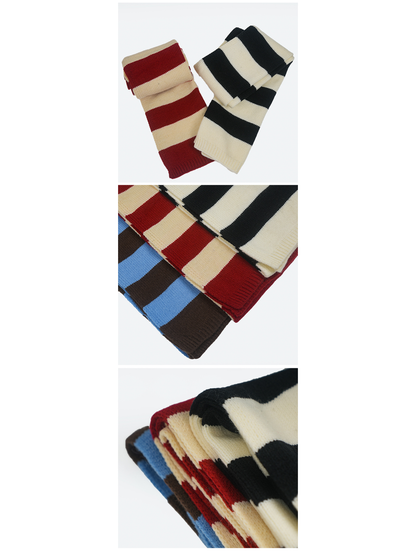 Blue and brown, red and cream, and black and cream striped scarves displayed together