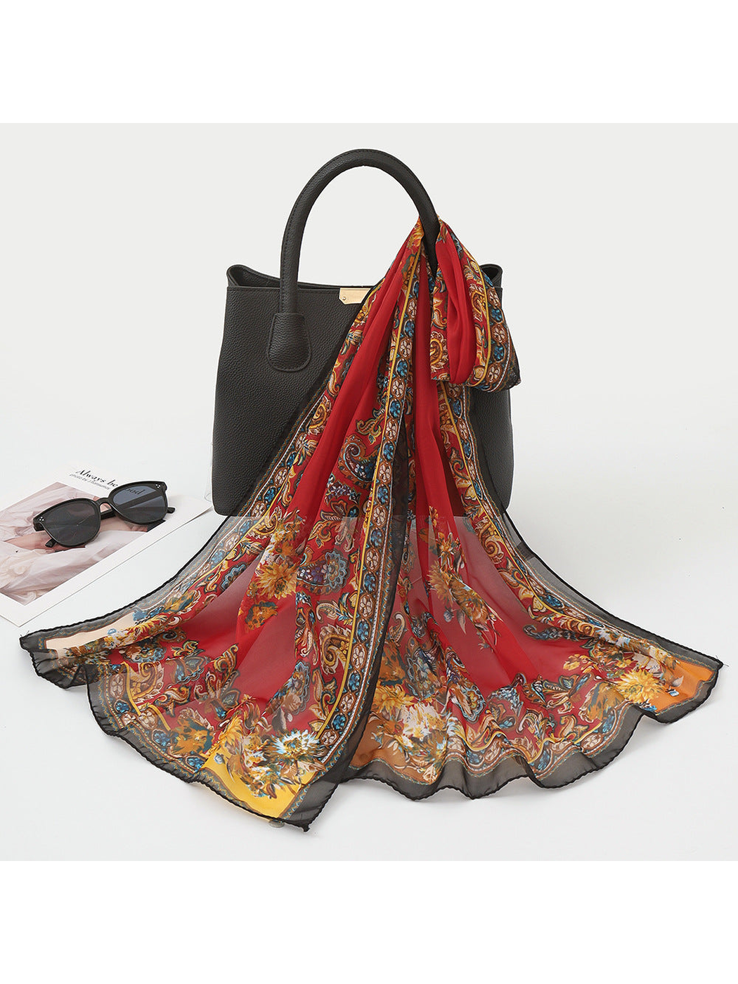 Red sheer scarf with paisley, floral motifs and an ornamental border