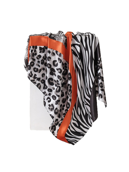 Gray animal-print square scarf with orange trim, draped view