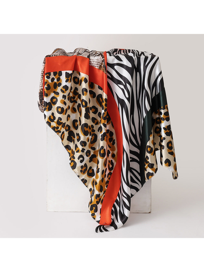 Gold and red animal-print square scarf, draped view