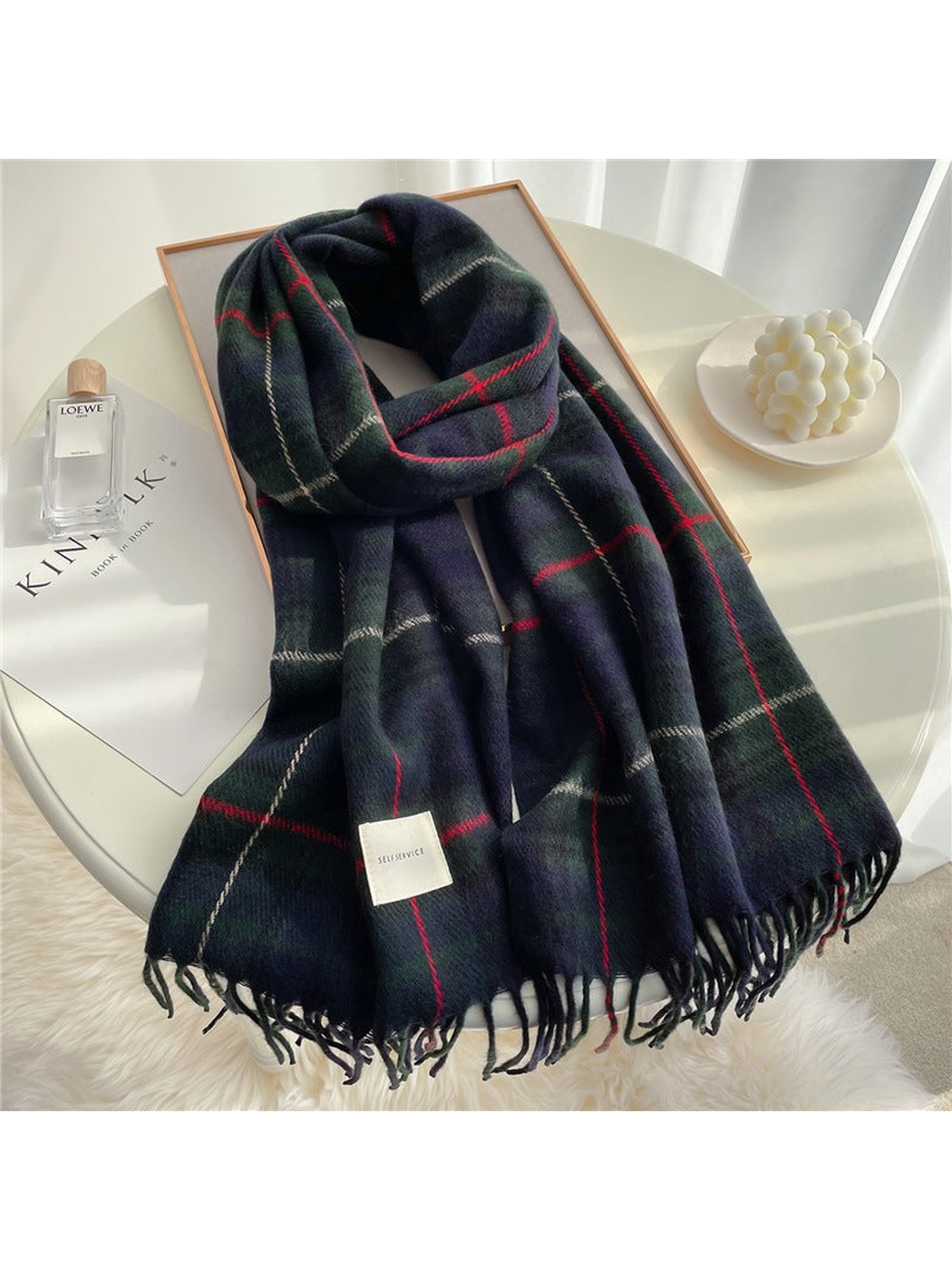 Dark navy and green plaid scarf with red grid lines and fringed ends