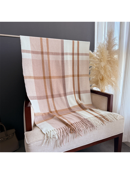 Blush and cream plaid scarf displayed at full length with fringed ends
