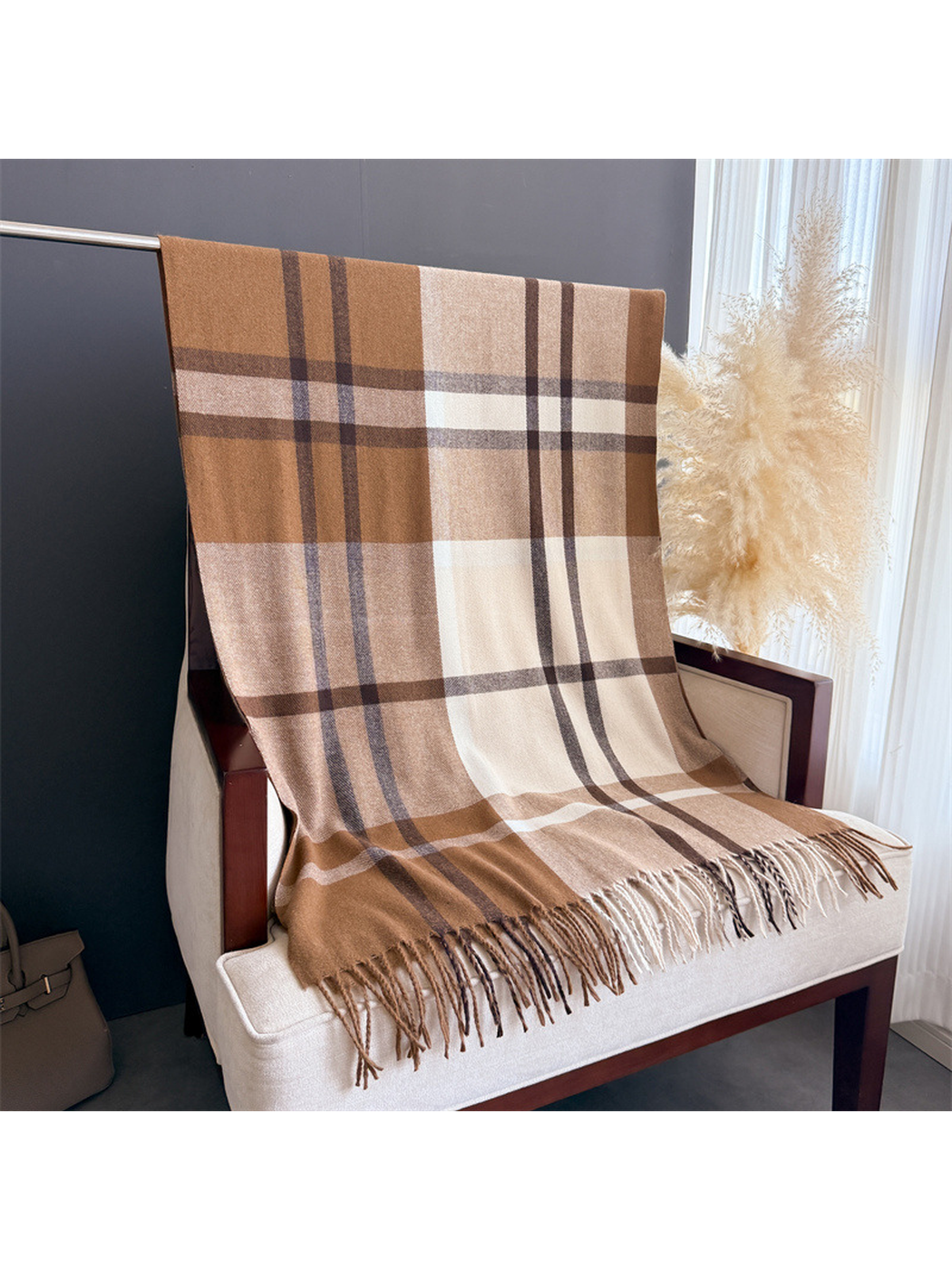 Brown, cream and charcoal plaid scarf displayed at full length with fringe