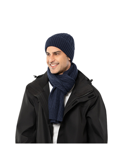 Navy cable-knit hat and scarf styled with a black jacket