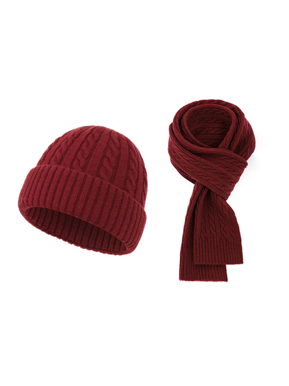 Burgundy cable-knit hat and scarf set on a white background