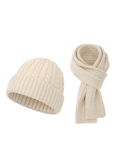 Beige cable-knit hat and scarf set on a white background